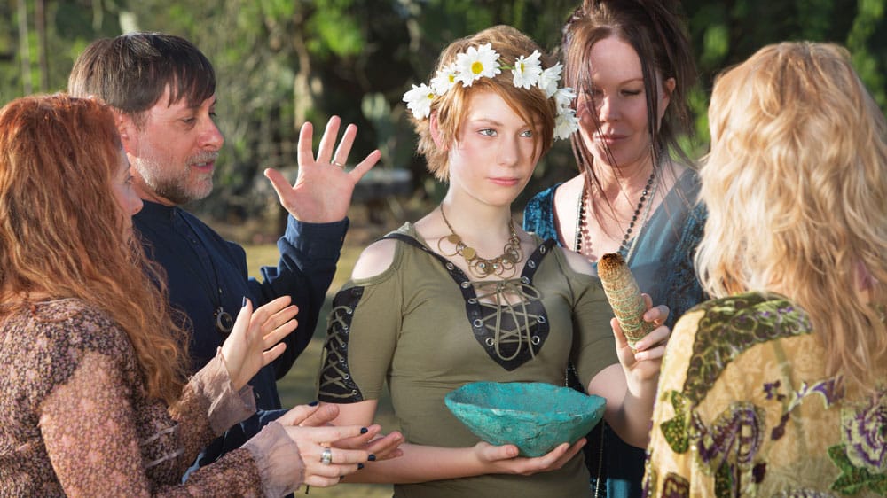 group of wiccans praying during Beltane holiday