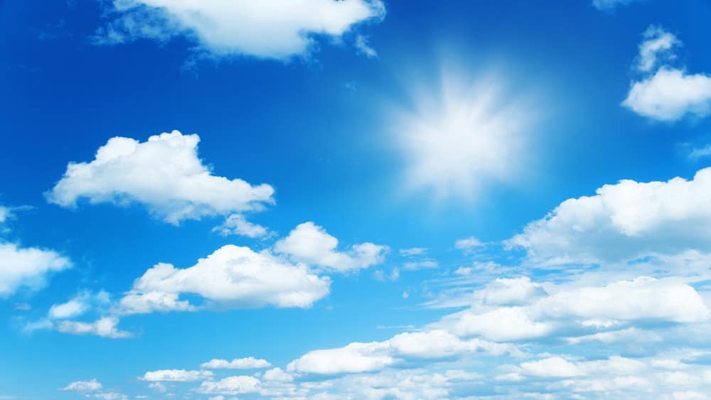 the sun high in the summer sky