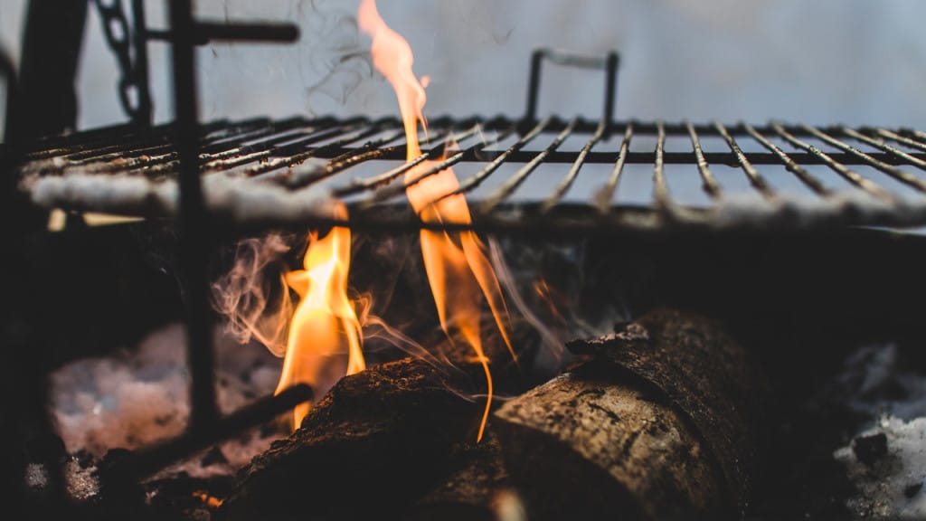 Logs burning in a grill