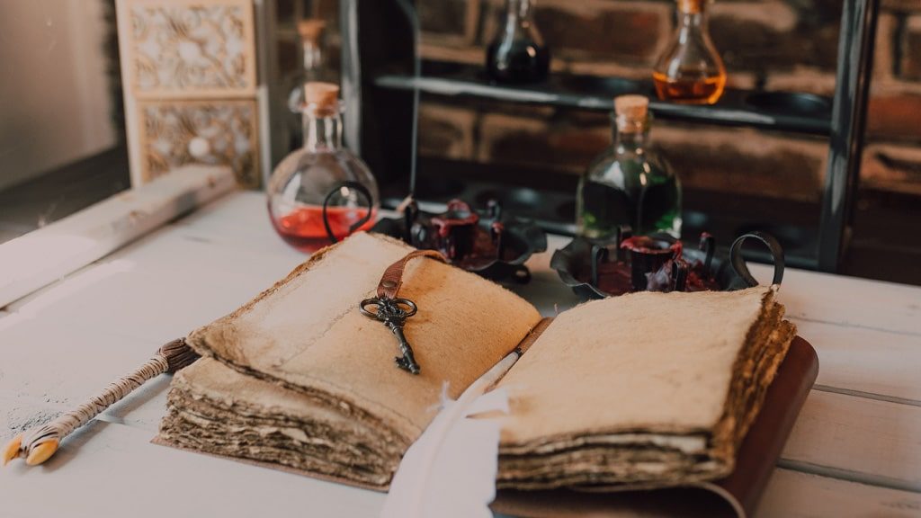 the old book and potions on a table