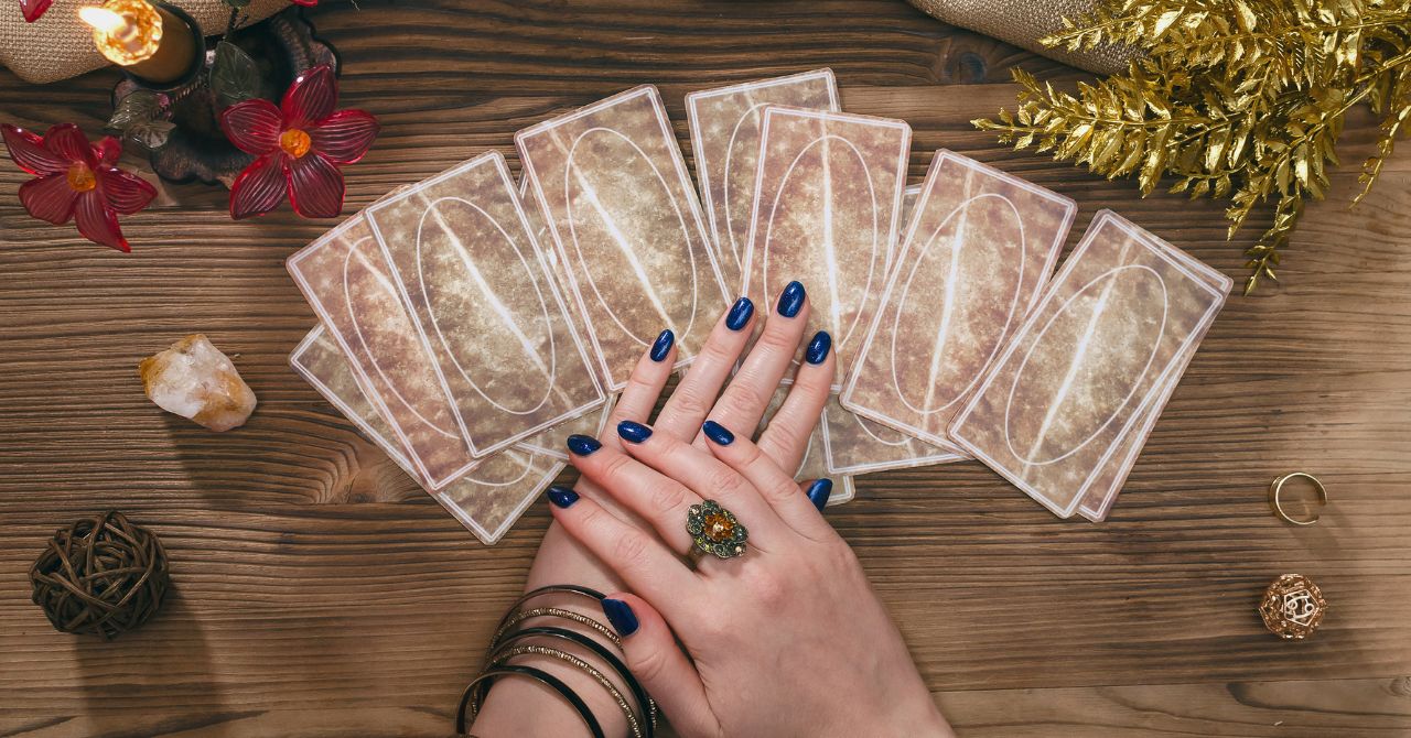 A Person Holding Tarot Cards