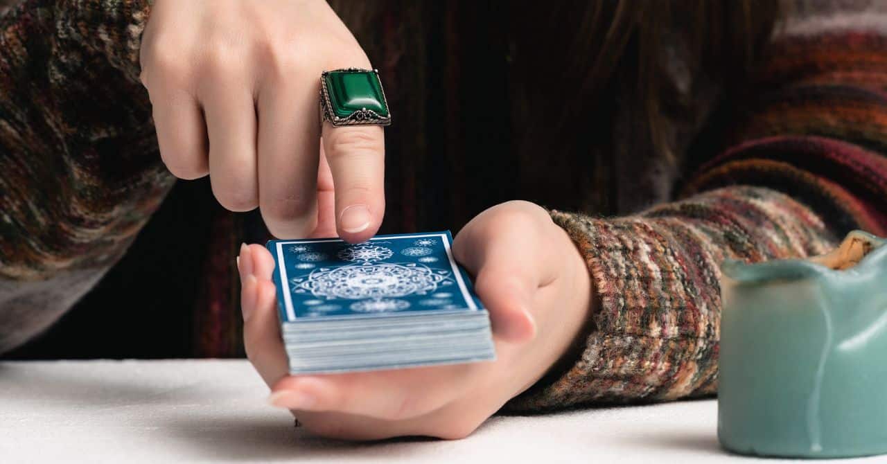 Woman Holding a Deck of Tarot Cards