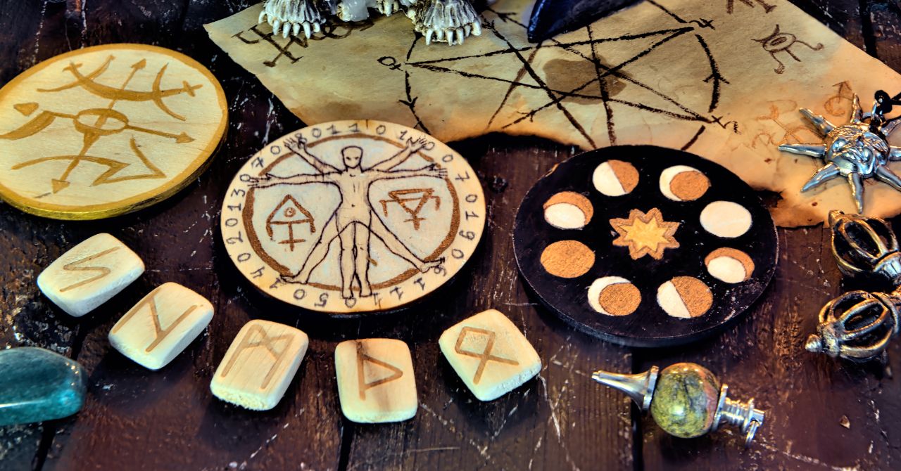 Many wicca signs and elements on the table