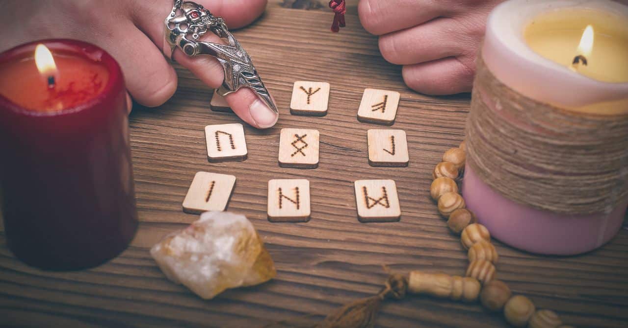 Nine runes and candles on the table