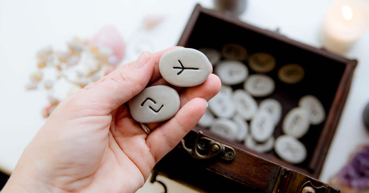 Woman's hands holding runes