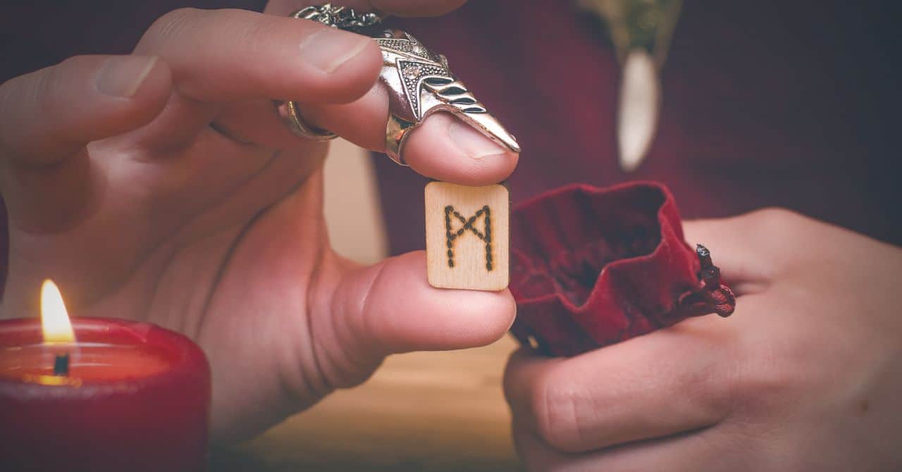 The wooden rune in hands
