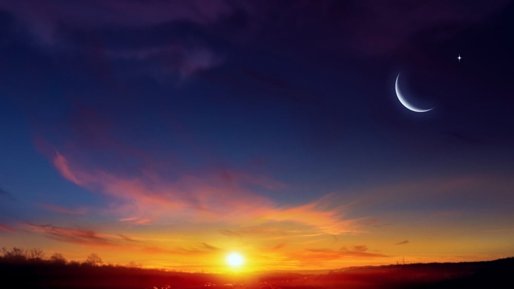 New Moon Phase Over a Beautiful Sunset