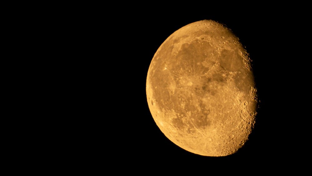 Waning Gibbous Moon Phase in a Pitch Black Night Sky