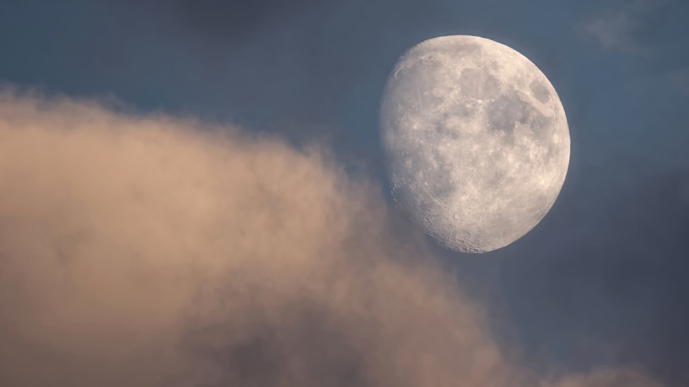 Waxing Gibbous Moon Phase in a Dark Cloudy Sky