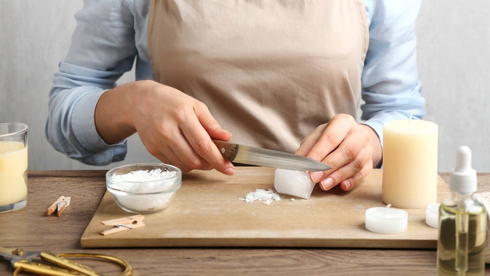 An artisan making a candle