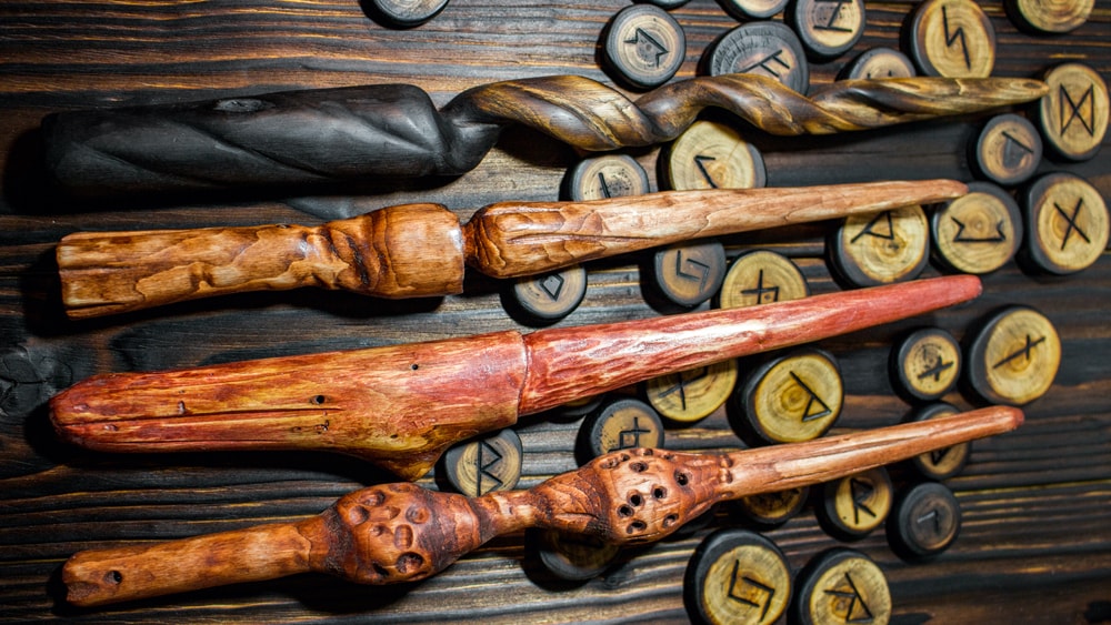 An assortment of ornate wooden wands