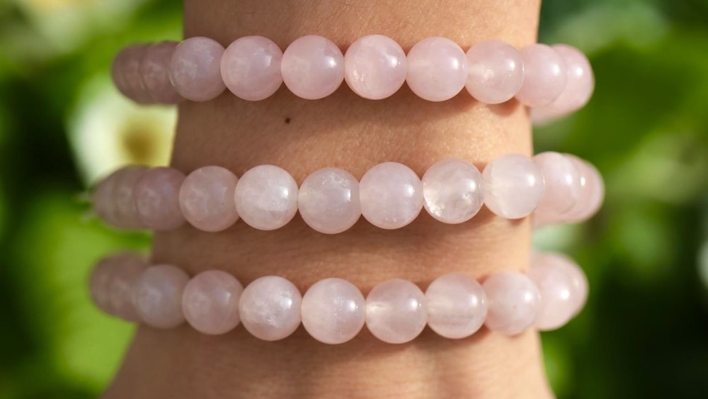 Wearing rose quartz crystal bead bracelets on your wrist