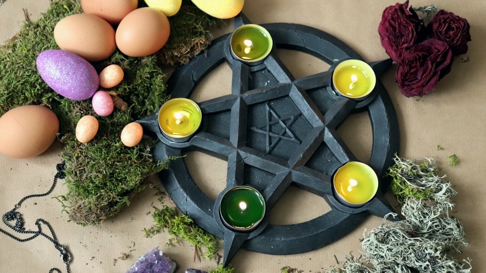 Ostara Altar with candles, eggs, moss, and roses