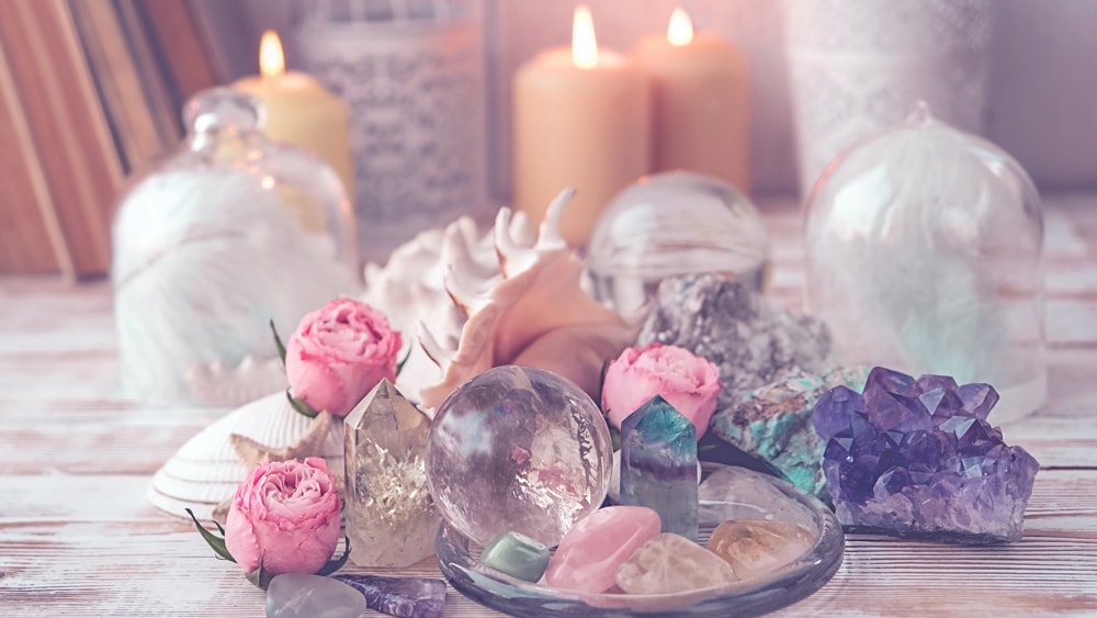 a collection of crystals and candles