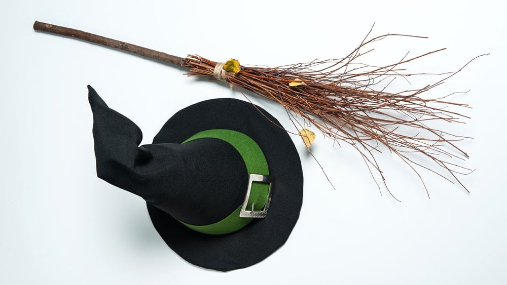 A witch's broom and hat