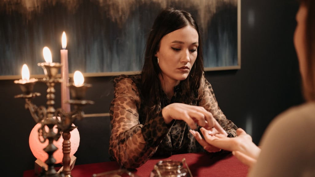 A witch performing a palm reading