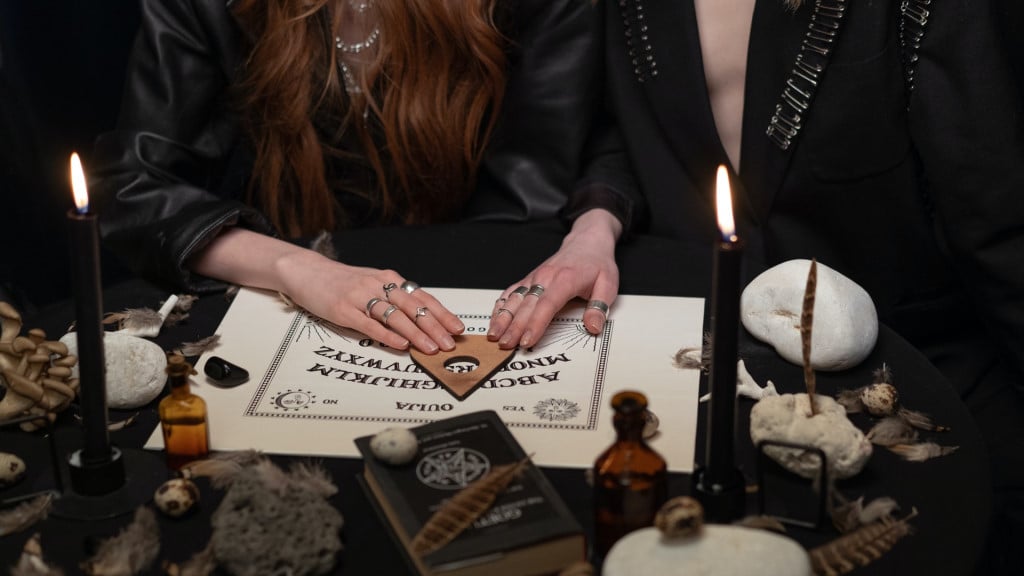 two women using a ouija board together