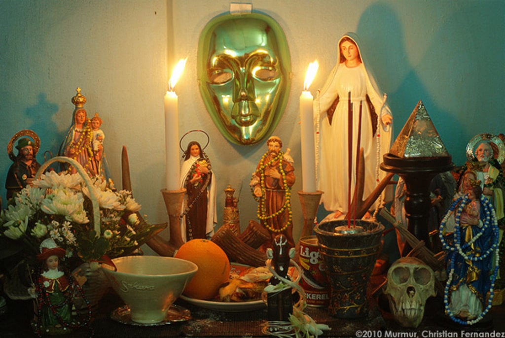 A Santeria altar featuring statues of catholic saints