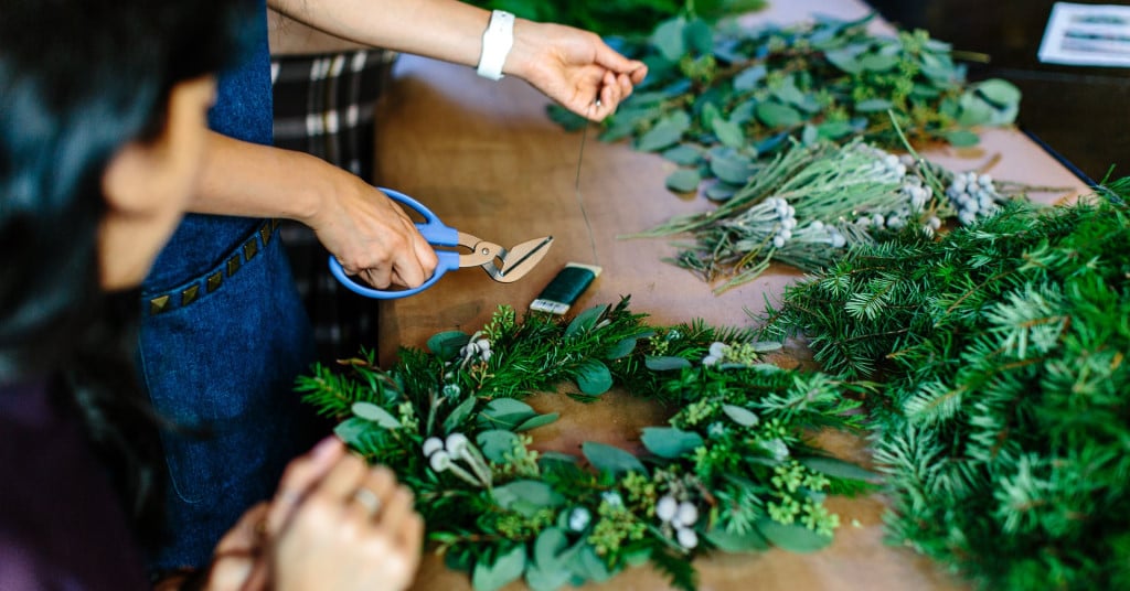 Women making wreaths by hand