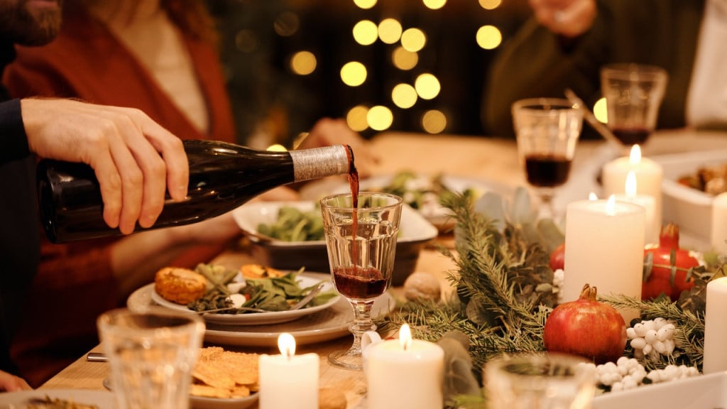 A Yule feast with evergreen and pomegranate table decorations