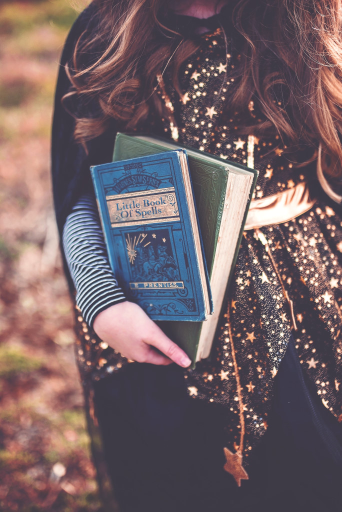 A witch carrying books