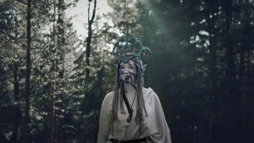 A pagan woman standing in a forest
