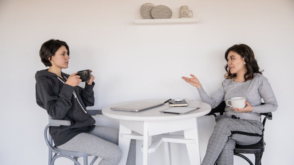 Two women chatting over coffee