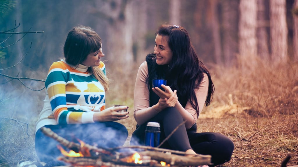 Two women having a conversation in the wilderness