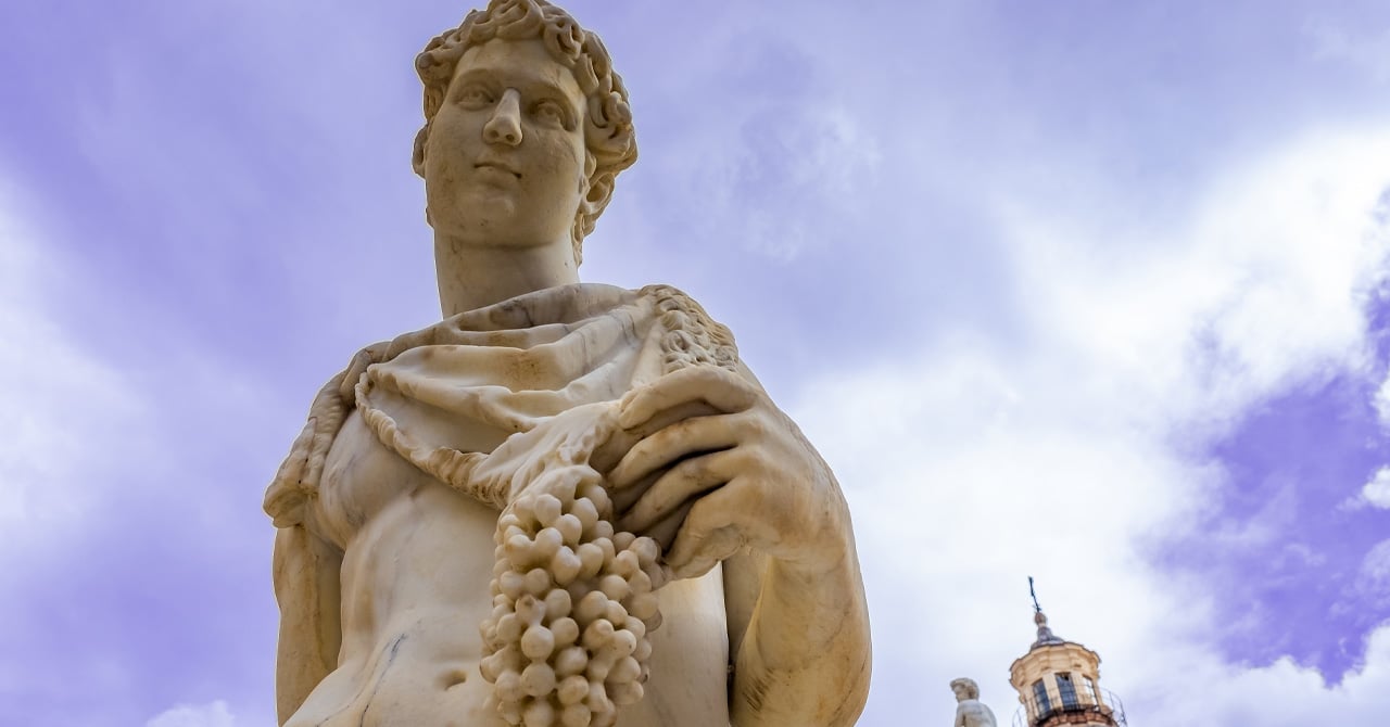 Statue of Dionysus or Bacchus with bunch of grapes